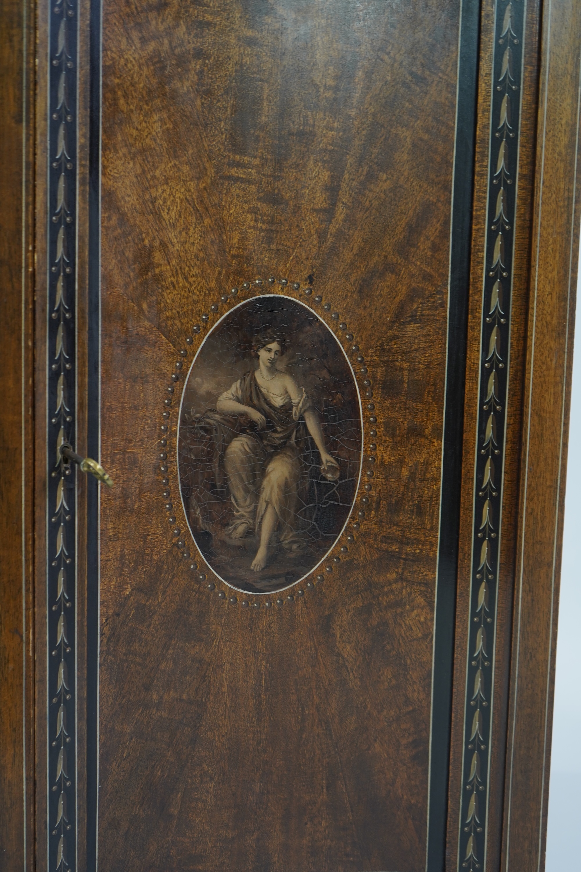 An Edwardian Sheraton Revival painted mahogany bowfront side cabinet